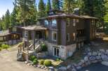 Experience luxury mountain living in this stunning custom-built home nestled among tall pines.