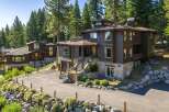 Nestled amidst towering pine trees, this stunning multi-level home offers a luxurious mountain retreat.