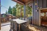 Enjoy al fresco dining on this spacious deck, complete with a large table and chairs perfect for entertaining.