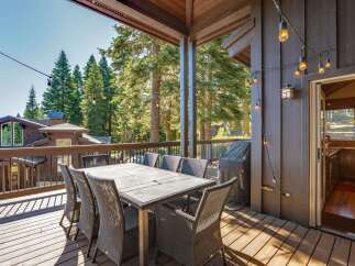 Enjoy al fresco dining on this spacious deck, complete with a large table and chairs perfect for entertaining.