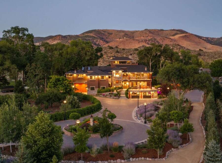 Experience luxury living in this stunning multi-level estate, nestled against a backdrop of majestic mountains.