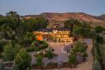 Experience luxury living in this stunning multi-level estate, nestled against a backdrop of majestic mountains.