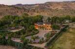 Experience luxurious living in this expansive estate, nestled against a backdrop of majestic mountains.