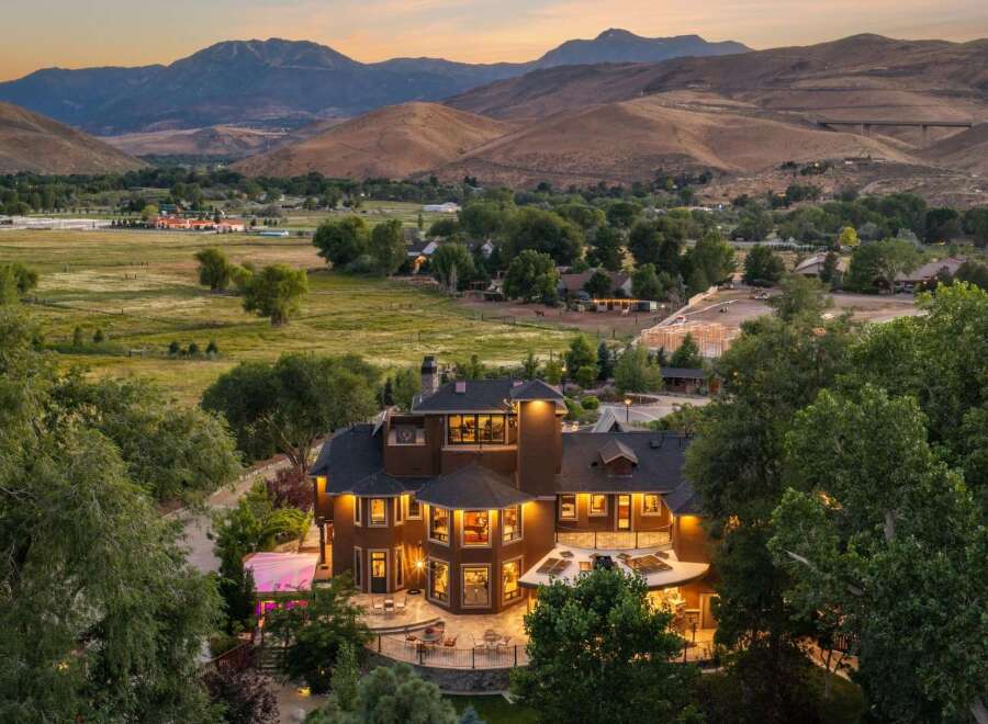 Experience luxury living in this stunning estate nestled amidst rolling hills and majestic mountains.