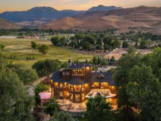 Experience luxury living in this stunning estate nestled amidst rolling hills and majestic mountains.