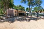 Discover this charming equestrian property featuring a well-maintained stable with two stalls and a tack room, perfect for housing your horses.