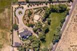Discover this expansive estate featuring a luxurious main residence and a separate guest house, perfect for multi-generational living or hosting visitors.