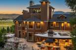 Experience luxury living in this stunning custom-built home, featuring a sprawling outdoor entertainment area with a built-in grill and pizza oven.