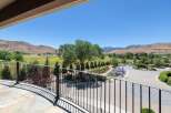 Experience breathtaking panoramic views from this stunning property, featuring a beautifully landscaped yard with mature trees and vibrant lavender gardens.