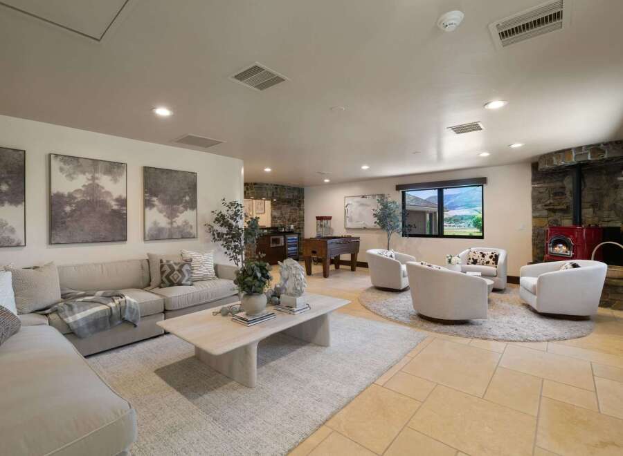 This spacious living area offers a comfortable sectional sofa, perfect for relaxing or entertaining.
