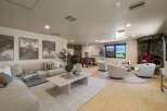 This spacious living area offers a comfortable sectional sofa, perfect for relaxing or entertaining.