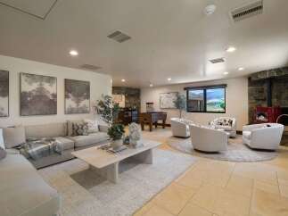 This spacious living area offers a comfortable sectional sofa, perfect for relaxing or entertaining.