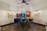 Step into a world of retro fun with this game room featuring three classic pinball machines: Jaws, Indiana Jones, and another themed machine.