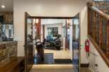 This unique property offers a spacious garage area perfect for motorcycle enthusiasts, featuring two distinct bikes ready for adventure.