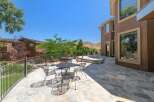 Enjoy outdoor living with this expansive stone patio, perfect for entertaining guests or relaxing with a view.