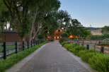 Welcome to this charming property, featuring a long brick pathway leading to a warm, inviting home.
