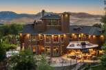 Experience luxury living in this stunning multi-level home, boasting breathtaking mountain views and an expansive outdoor entertainment area.