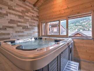 Indulge in ultimate relaxation in this luxurious indoor hot tub, featuring a spacious design and soothing jets.