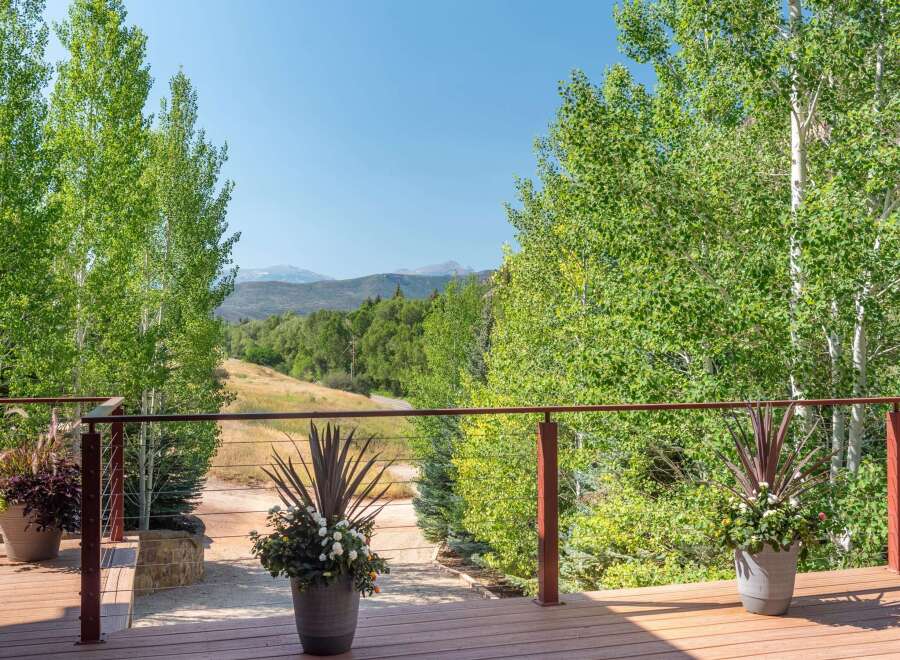 Enjoy breathtaking mountain views from this expansive deck, perfect for entertaining or quiet relaxation.