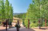 Enjoy breathtaking mountain views from this expansive deck, perfect for entertaining or quiet relaxation.