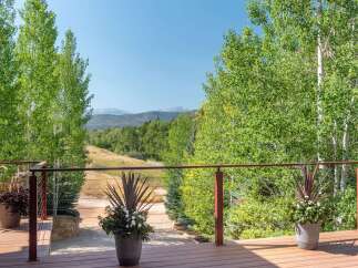 Enjoy breathtaking mountain views from this expansive deck, perfect for entertaining or quiet relaxation.