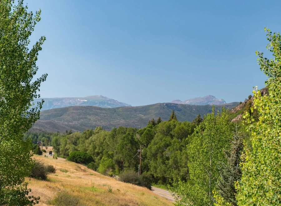 Experience the serene beauty of this mountain landscape, perfect for a secluded getaway or a peaceful residence.