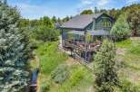 Experience the perfect blend of nature and modern living in this stunning green home, nestled amidst lush trees and a serene stream.