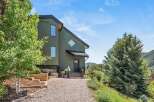 Nestled amidst lush greenery and rolling hills, this charming home offers a serene retreat.