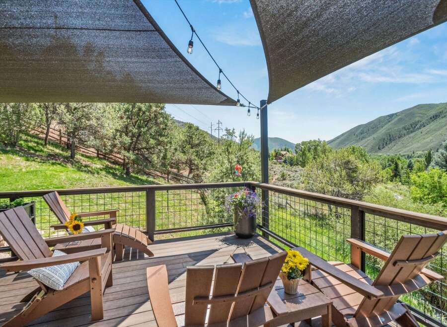 Enjoy breathtaking mountain views from this expansive deck, perfect for outdoor entertaining or quiet relaxation.