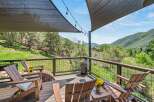 Enjoy breathtaking mountain views from this expansive deck, perfect for outdoor entertaining or quiet relaxation.