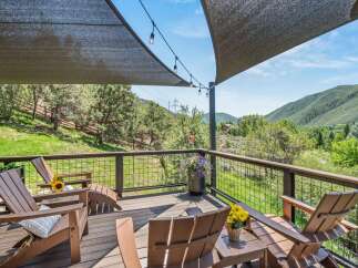 Enjoy breathtaking mountain views from this expansive deck, perfect for outdoor entertaining or quiet relaxation.
