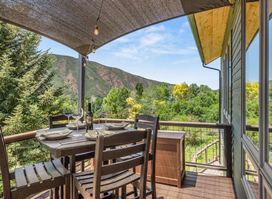 Enjoy breathtaking mountain views from this stunning deck, perfect for al fresco dining or relaxing with a glass of wine.
