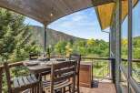 Enjoy breathtaking mountain views from this stunning deck, perfect for al fresco dining or relaxing with a glass of wine.