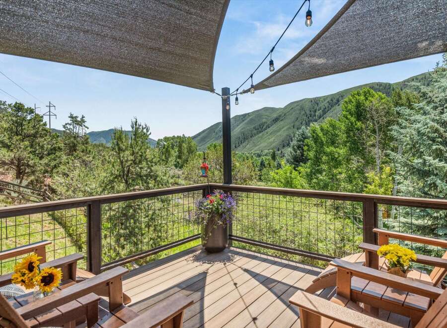 Enjoy breathtaking mountain views from this expansive deck, perfect for outdoor entertaining or quiet relaxation.