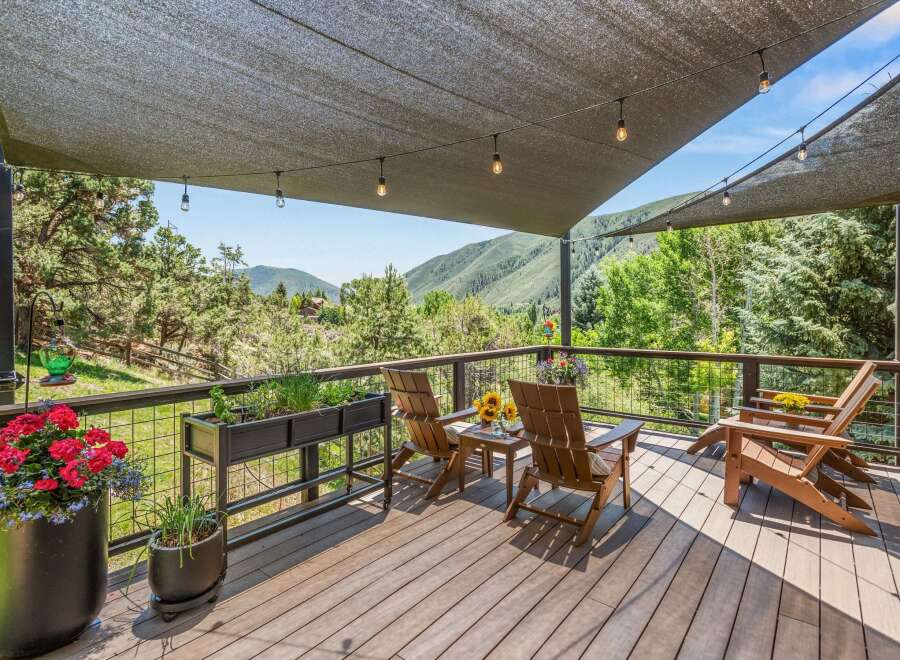 Enjoy breathtaking mountain views from this expansive deck, perfect for outdoor entertaining or quiet relaxation.