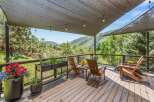 Enjoy breathtaking mountain views from this expansive deck, perfect for outdoor entertaining or quiet relaxation.