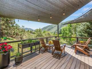 Enjoy breathtaking mountain views from this expansive deck, perfect for outdoor entertaining or quiet relaxation.