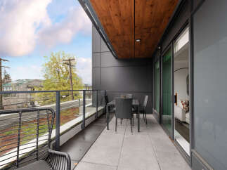 Enjoy outdoor living on this spacious balcony, perfect for al fresco dining or relaxing with a view.
