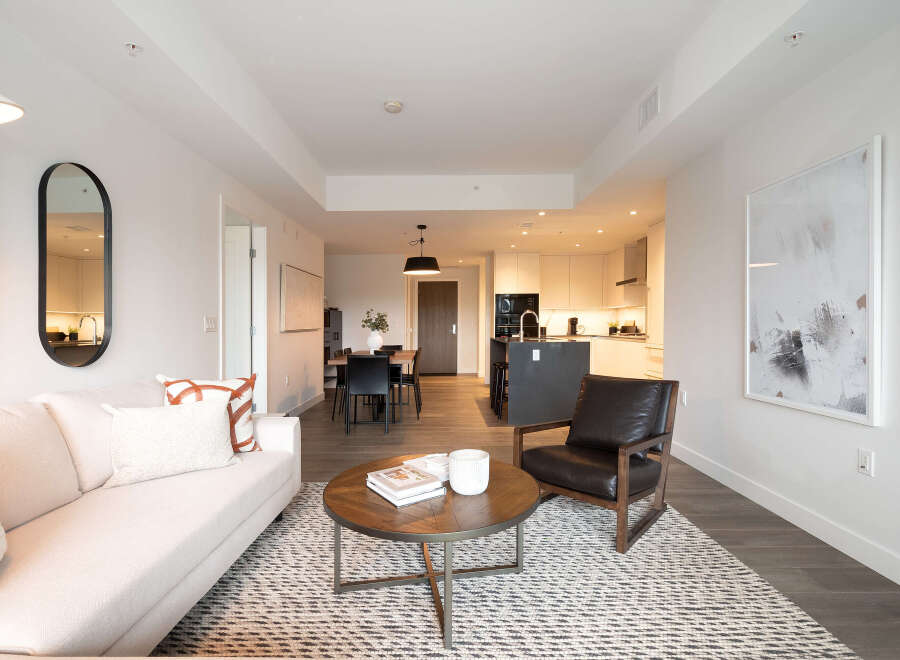Experience modern living in this beautifully appointed apartment, featuring a spacious open-concept living and dining area perfect for entertaining.
