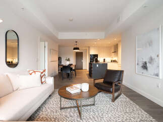 Experience modern living in this beautifully appointed apartment, featuring a spacious open-concept living and dining area perfect for entertaining.