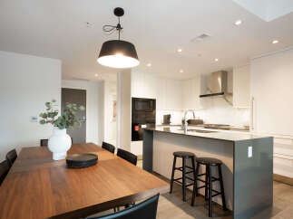Experience modern living in this stunning open-concept kitchen and dining area.
