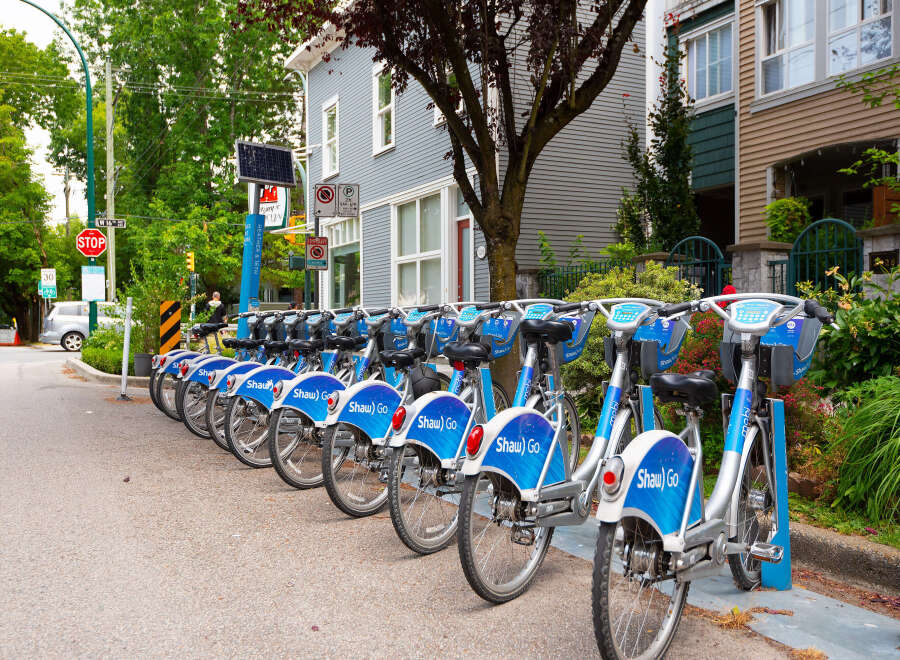 Discover convenient urban living with this prime real estate opportunity, featuring a row of readily available bike rentals perfect for exploring the vibrant neighborhood.
