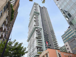Experience modern urban living in this stunning high-rise apartment building, featuring sleek architecture and expansive balconies offering breathtaking city views.