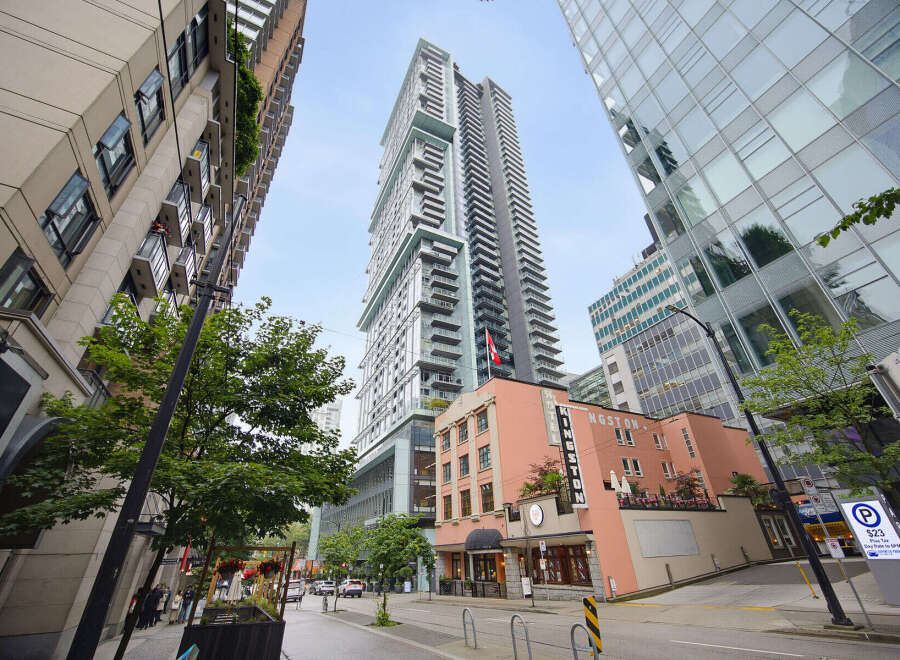 Experience modern urban living in this stunning high-rise building, featuring sleek architecture and expansive balconies.