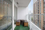 Enjoy your morning coffee or evening relaxation on this charming balcony, complete with comfortable seating and a stylish side table.