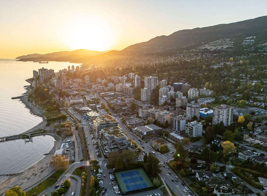 Experience breathtaking sunset views from this prime waterfront property, offering a vibrant urban lifestyle with stunning natural backdrops.
