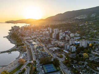 Experience breathtaking sunset views from this prime waterfront property, offering a vibrant urban lifestyle with stunning natural backdrops.