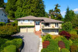 Discover this charming home nestled amidst lush greenery and mature trees, offering a serene and private retreat.