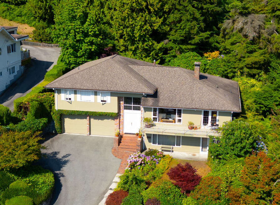 Discover this charming home nestled amidst lush greenery, offering a serene retreat.