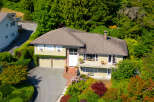 Discover this charming home nestled amidst lush greenery, offering a serene retreat.